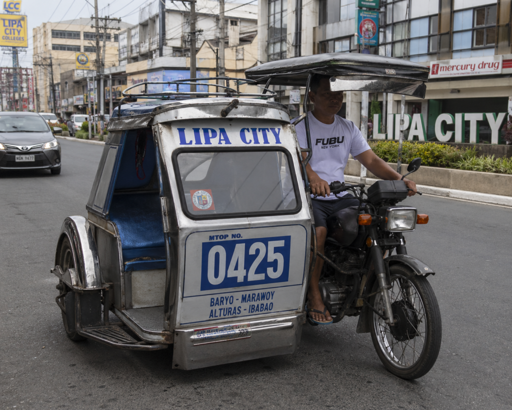 Tricycles are the most common way to travel around Lipa City, especially for short distances from the terminal to hotels or tourist spots.