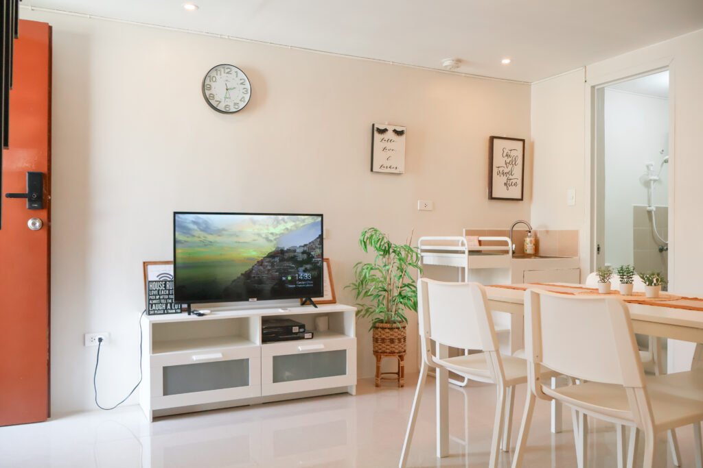 HavenInLipa 1BR living room with wine and cheese for two - couples vacation rental.