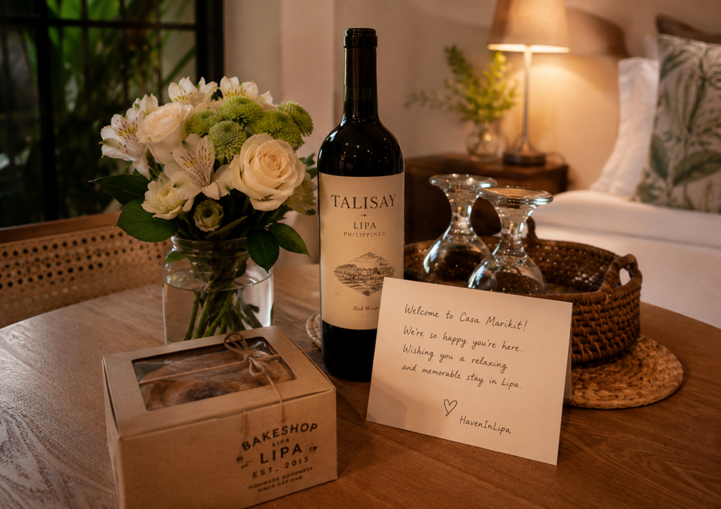 Anniversary welcome arrangement at HavenInLipa 1BR - flowers wine and dessert for couples. 