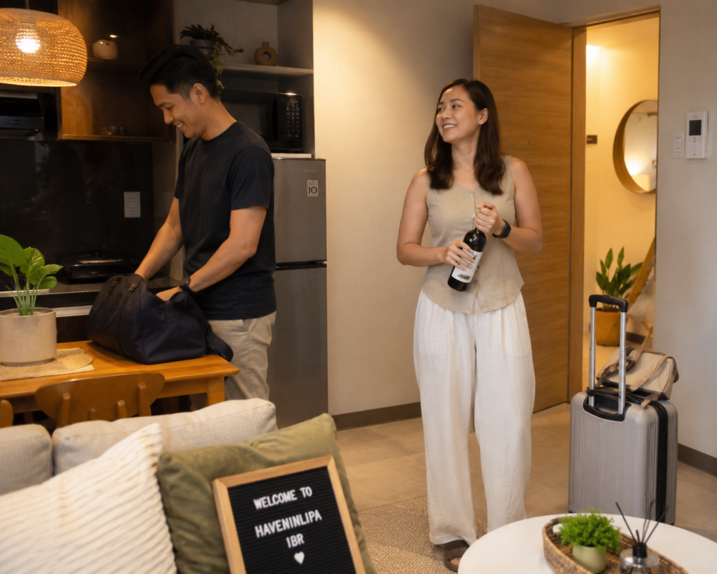 Couple settling into a Lipa City vacation rental for a romantic Batangas weekend.