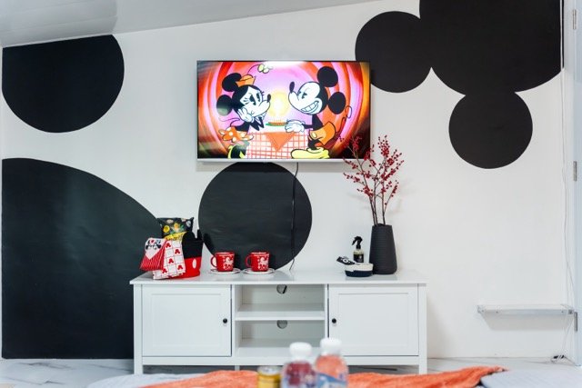 Mickey in Lipa master bedroom with Mickey silhouette wall and the TV in the middle