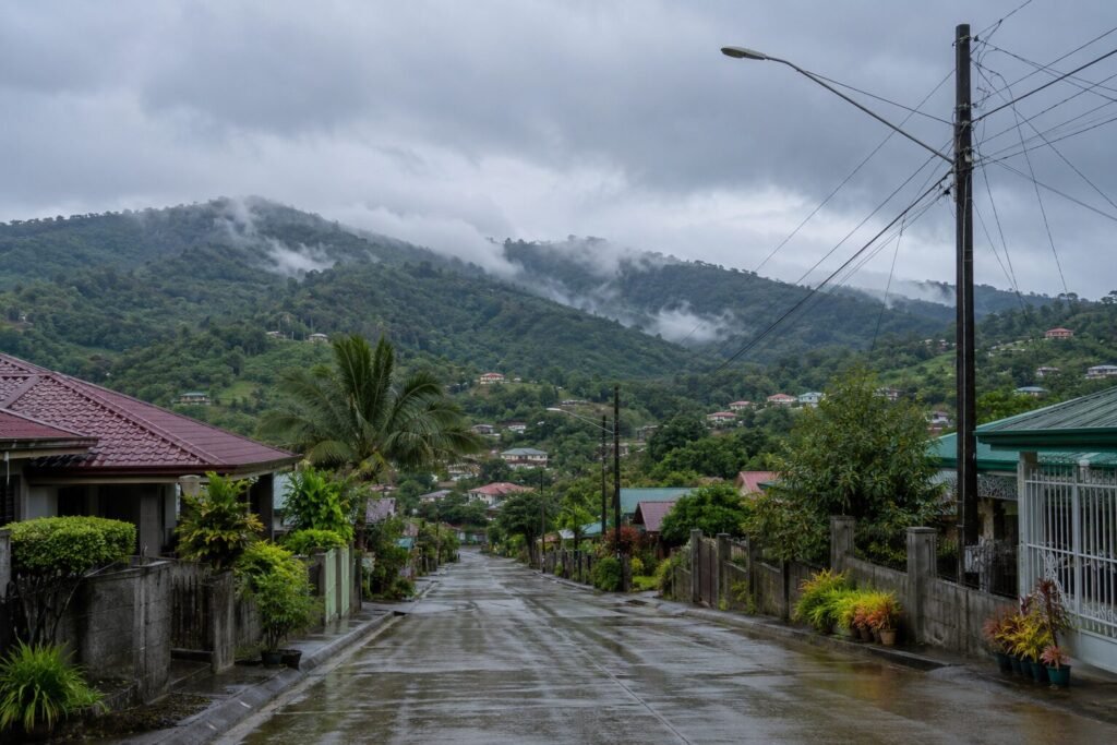 "Lipa City village in July rainy season - green hills and cool weather"